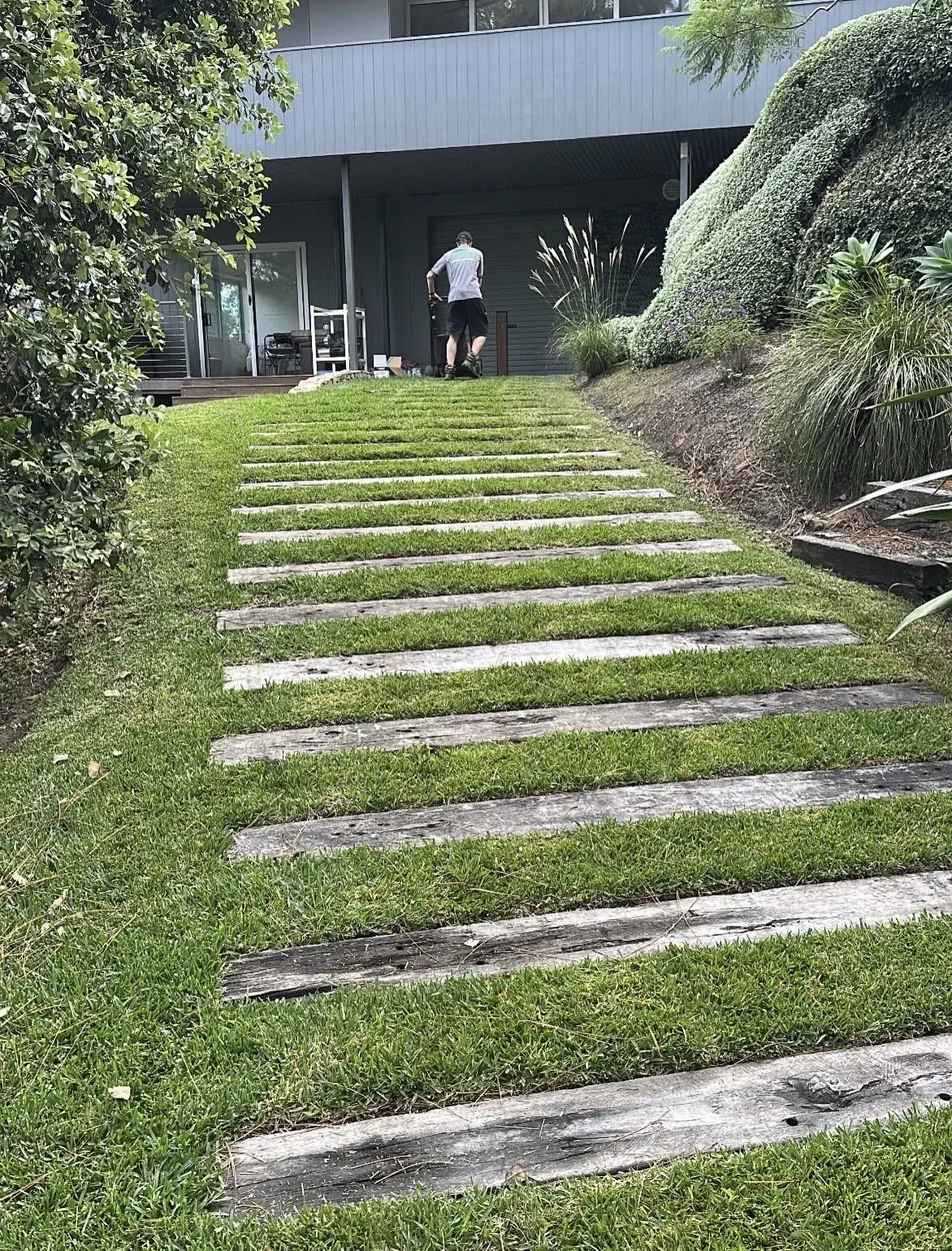 Lawn and timber steps at a large property